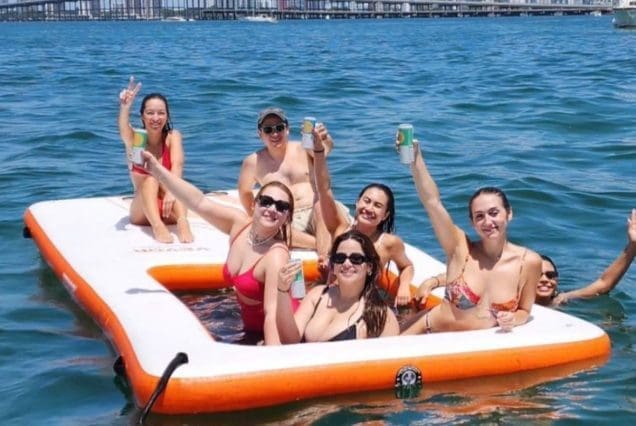 Luxury 110ft Dominator Senay Miami superyacht with jacuzzi available for charter with premium inflatable pool add-ons.