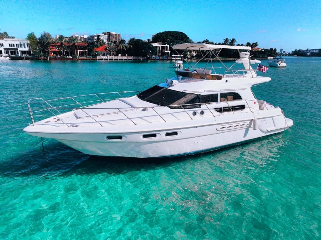 50ft Monaco SEALINE Miami bow lounge area with breathtaking views of Biscayne Bay and the Miami skyline