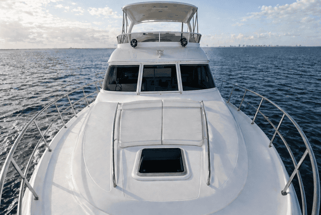 58ft Sea Ray Miami bow lounge area with breathtaking views of Biscayne Bay and the Miami skyline